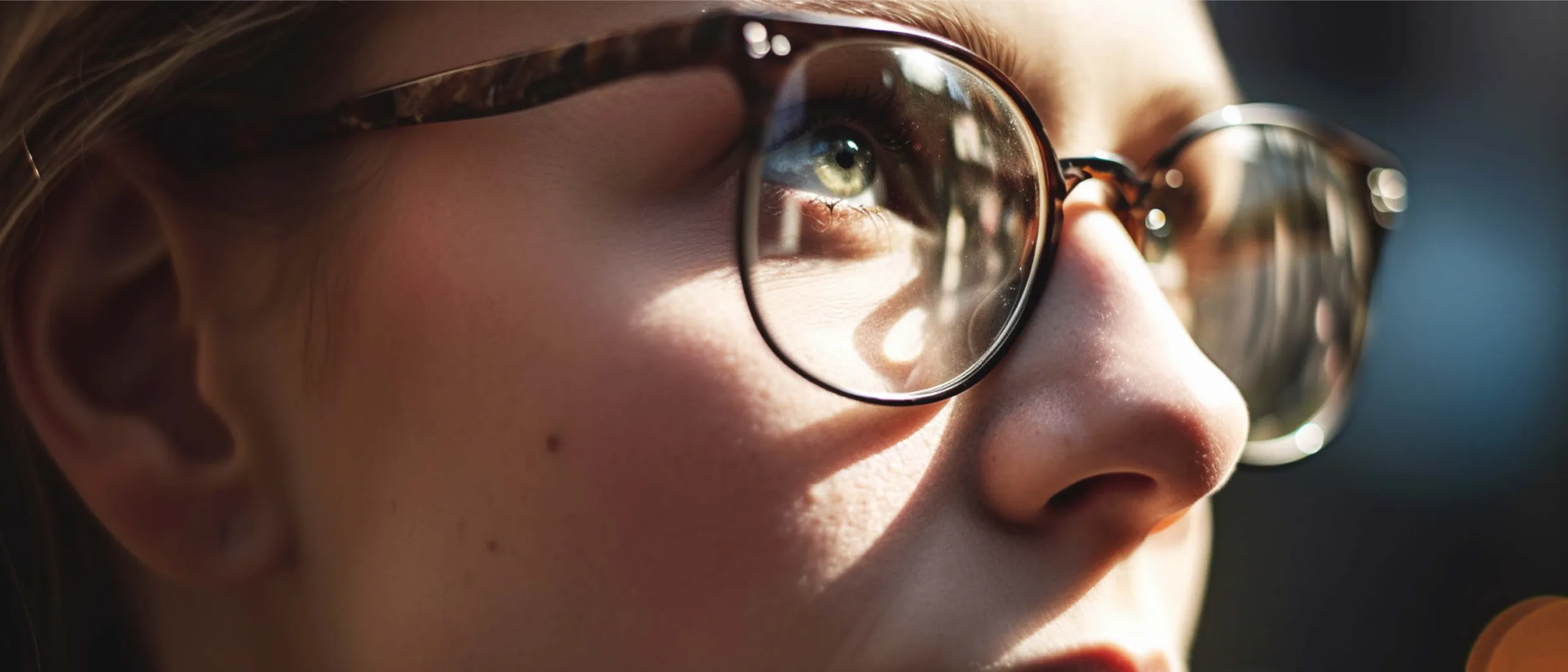 Close up on a person wearing glasses