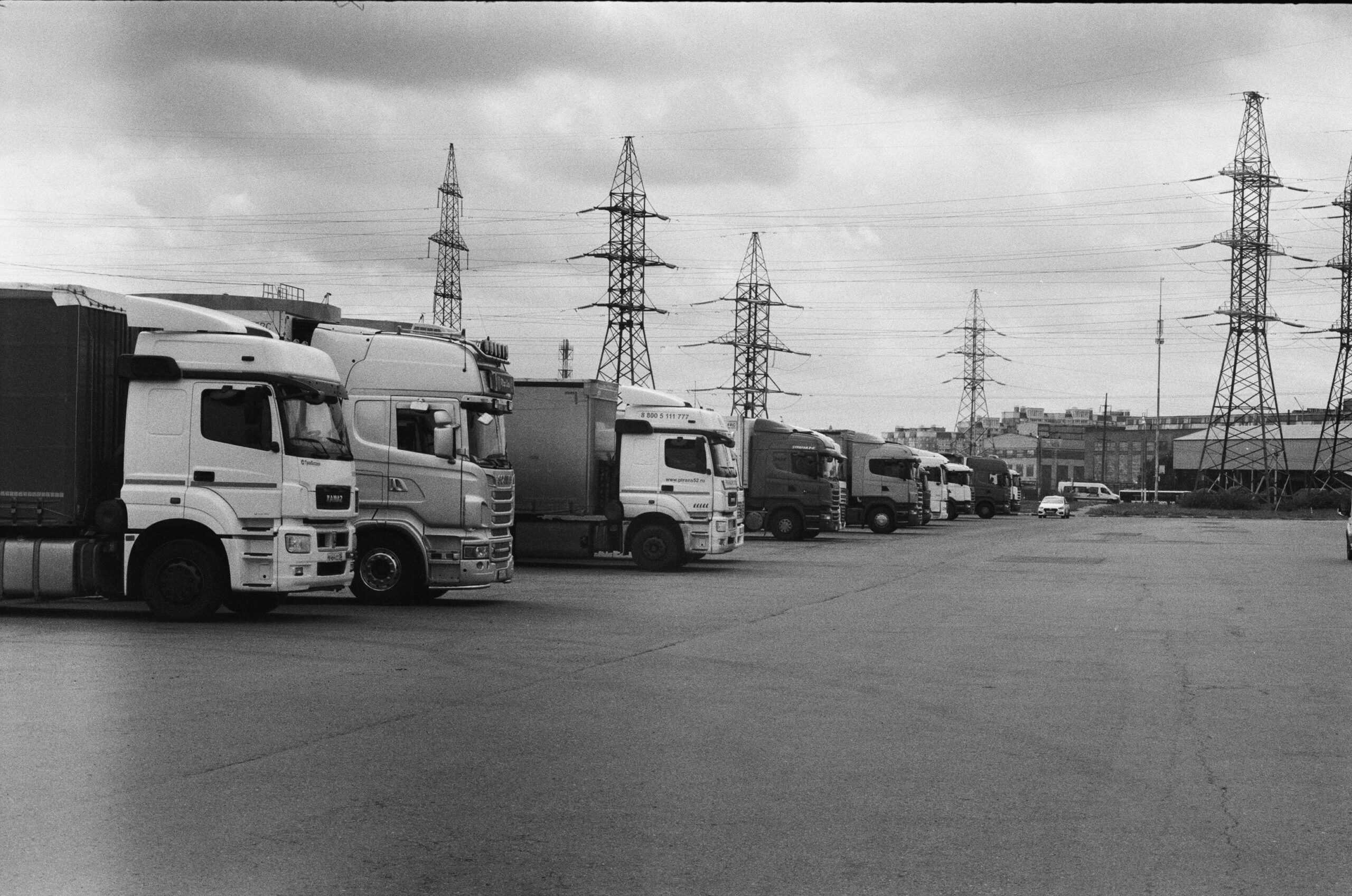 Several trucks in a row in parking area